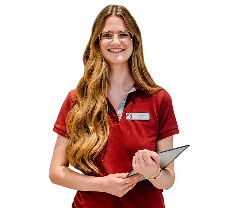 Woman with long hair and glasses, wearing a red polo shirt and name tag, smiles while holding a tablet.